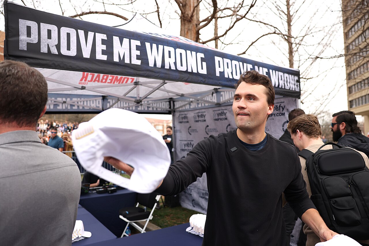 Charlie Kirk speaking at a public event linked to professor watchlist debates