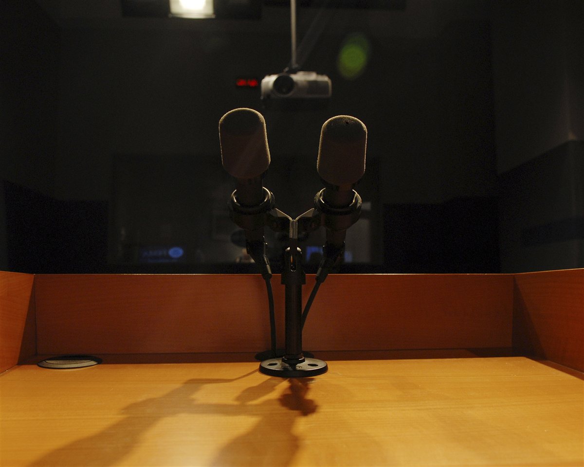 Podium microphones image supporting charlie kirk religion denomination evidence-confidence workflow