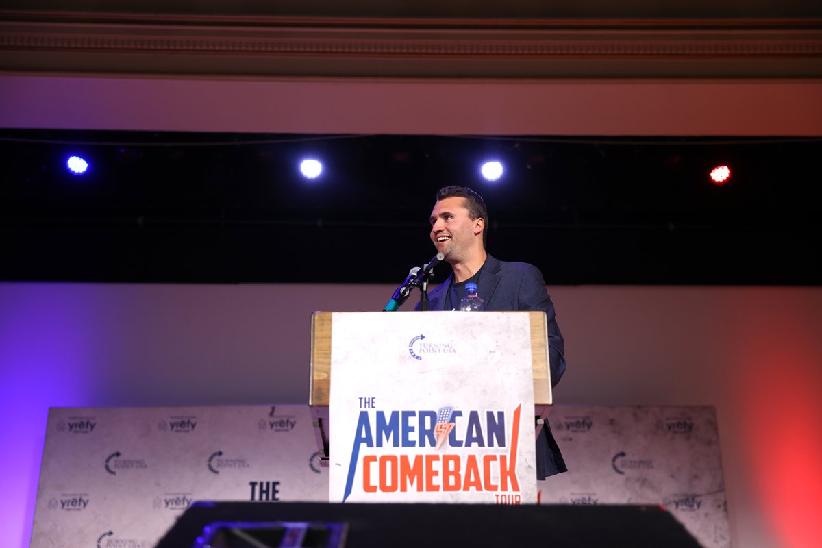 Student assembly scene relevant to charlie kirk high school chapter guide planning